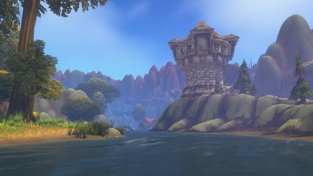 A stone tower beside a lake